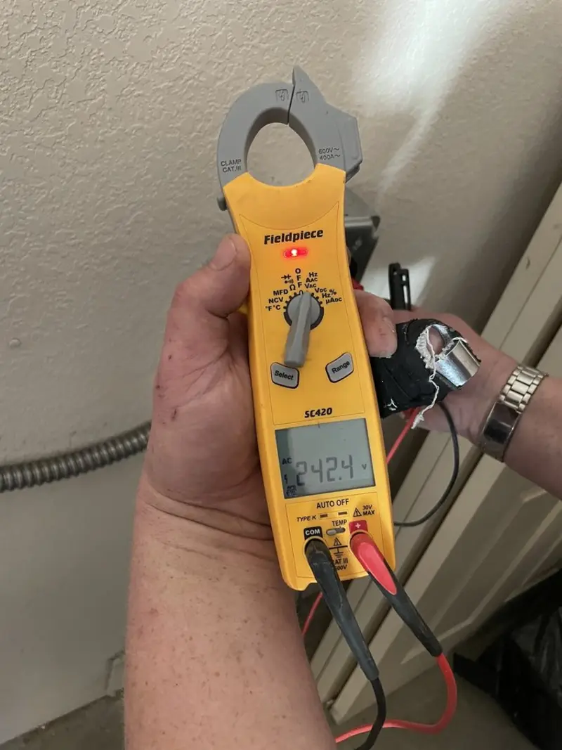Voltage testing with clamp meter during Electrical Installation Services in Swansboro